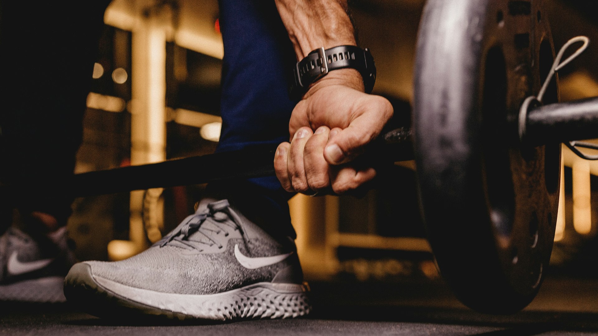 Person running on treadmill showing dedication to fitness